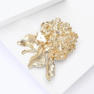 Detailed back view of gold enamel hydrangea brooch showing secure safety pin clasp
