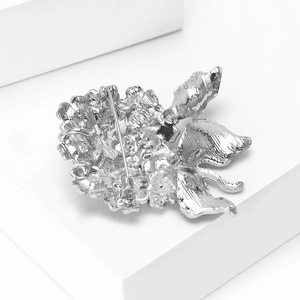Detail view of the silver metal hydrangea brooch back showing secure pin safety clasp