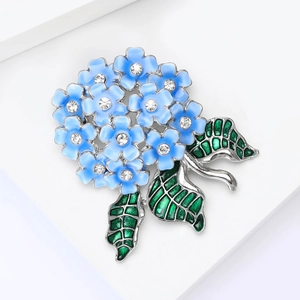 Close-up of blue enamel hydrangea brooch with sparkling crystal flower centers