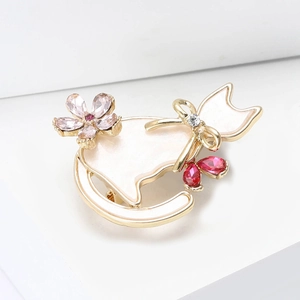 Elegant gold cat brooch with cream enamel and pink rhinestone cherry blossoms