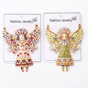 Close-up of enamel angel pins with mosaic design on a Fashion Jewelry display card