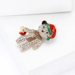 Detail of Christmas bear brooch with sparkling rhinestones and colorful enamel accents