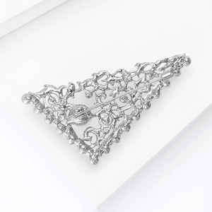 Detailed back view of silver rhinestone tree brooch with secure pin lock mechanism