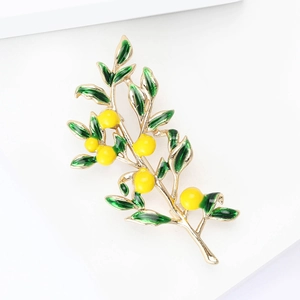 Elegant lemon tree branch brooch with green enamel leaves and yellow fruit on gold metal