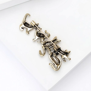 Detailed back view of vintage alloy kitten brooch showing the secure safety pin fastening