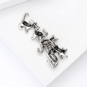 Detail view of the vintage silver metal alloy cat brooch back with secure pin clasp