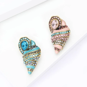 Elegant conch-shaped brooch set with colorful rhinestones and light blue enamel coating