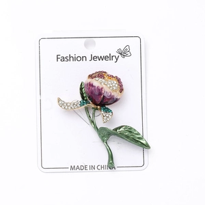Detailed view of tulip brooch with purple enamel petals and crystal-encrusted edges