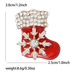 Detailed view of red Christmas stocking brooch with inlaid diamonds and size dimensions
