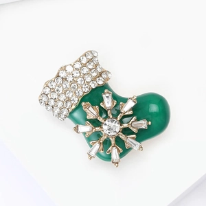 Green Christmas stocking brooch with sparkling crystals and golden edges for festive attire