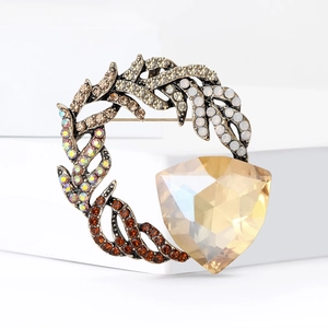 Vintage gold circle brooch with multicolored rhinestones and amber triangle gemstone