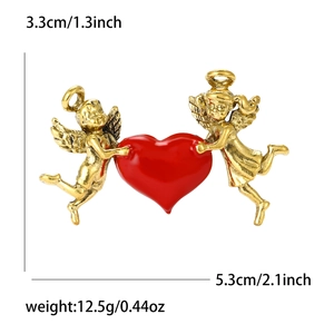Vintage gold angel heart brooch with red enamel wings including dimension details