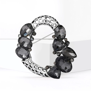 Vintage luxury wreath brooch with hollow geometric design and dark crystal stones