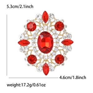 Detail view of large oval red rhinestone brooch with specific size and weight dimensions