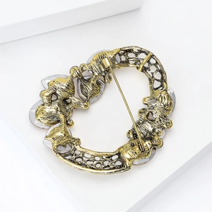 Vintage luxury gold crystal wreath brooch with hollow geometric design in antique gold finish
