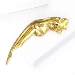 Macro shot of the polished gold panther brooch back side showing the pin fastener