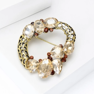 Detailed macro view of retro luxury hollow wreath brooch with inlaid crystal gemstones