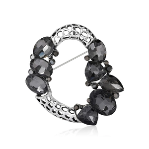Vintage luxury wreath brooch with hollow silver base and grey crystal gemstones