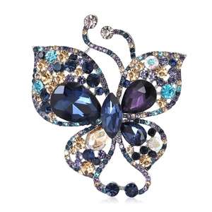 Luxurious rhinestone butterfly brooch with silver base and multicolored crystals on white background