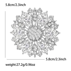 Detail showing crystal flower brooch dimensions of 5.8cm and 27.2g weight on white background