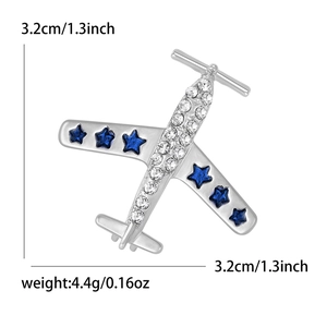 Broche avion argentée avec strass blancs et pierres précieuses étoiles bleues pour costumes