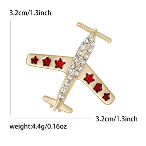Broche avion dorée élégante avec cristaux et étoiles rouges pour costume et manteau