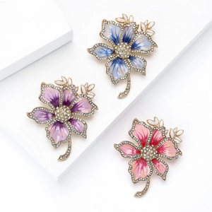 Elegant flower brooch with sparkling rhinestones and enamel petals in gradient colors