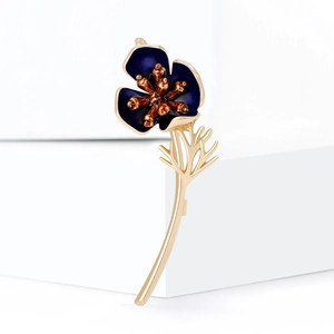 Exquisite blue enamel poppy brooch with gold stem and leaves on a white background
