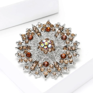Macro view of mandala crystal brooch featuring amber rhinestones and hollow alloy design