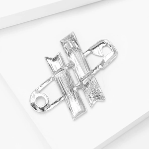 Detailed back view showing the silver metal safety pin fastener and polished texture