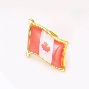 Elegant wavy Canada flag lapel pin with gold plating and red maple leaf emblem