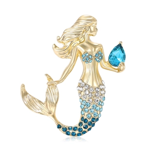 Exquise gouden zeemeermin broche met blauwe kristallen en een grote blauwe druppelvormige steen