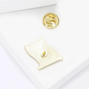 Back view of gold Ukraine flag pin showing the textured metal finish and butterfly clasp