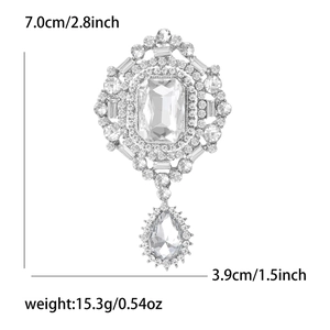 Detail view of vintage emerald cut glass brooch showing 7cm length and 15.3g weight