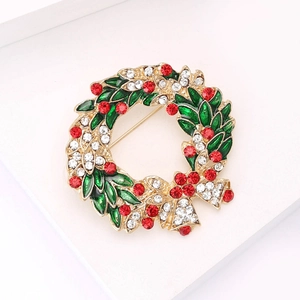 Exquisite Christmas wreath brooch with green enamel leaves and sparkling crystal rhinestones