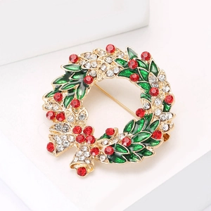 Exquisite Christmas wreath brooch with green leaves and sparkling red rhinestones
