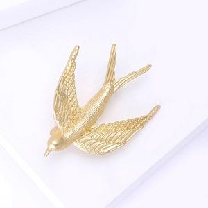 Elegant matte gold swallow bird brooch for women, luxury vintage animal pin for suit lapels