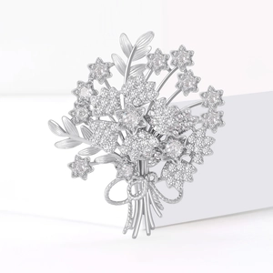 Elegant silver bouquet brooch with sparkling cubic zirconia stars and a ribbon bow tie