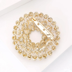 Golden rhinestone circular brooch with elegant hollow petal design and secure safety pin