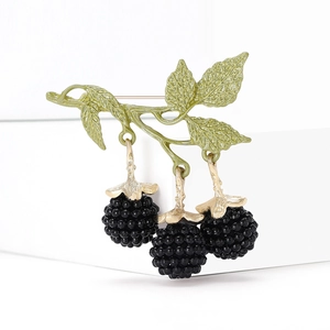 Elegant blackberry enamel brooch featuring dark berries and green alloy leaves on white blocks