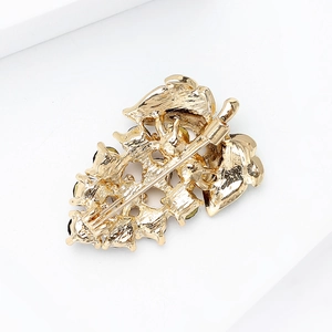 Elegant gold-plated grape leaf brooch with rhinestone detail and secure pin back