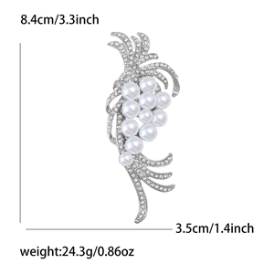 Detail showing pearl and rhinestone brooch dimensions 8.4cm by 3.5cm on white background