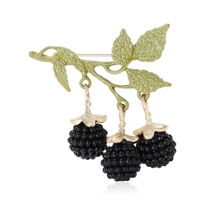Enamel blackberry fruit brooch with green leaves and golden stem on white background
