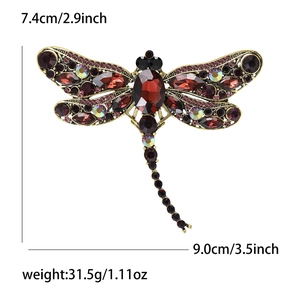 Detailed size chart of vintage dragonfly brooch featuring red rhinestones and gold metal