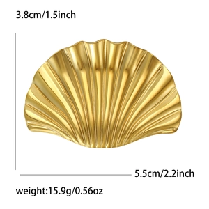 Macro view showing dimensions and weight of the shell-shaped golden stainless steel brooch