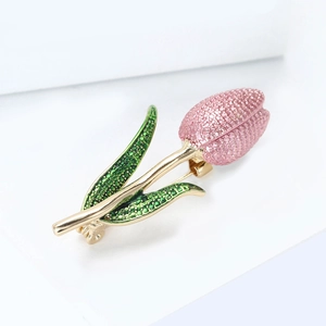 Detail of pink enamel tulip brooch showing fine grain petals and gold plating