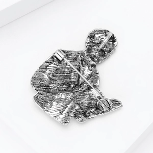 Detail of vintage silver pin back with sturdy needle clasp on retro metal brooch