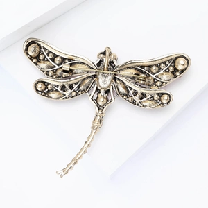 Detailed back view of vintage dragonfly brooch showing the secure pin fastener and metal finish