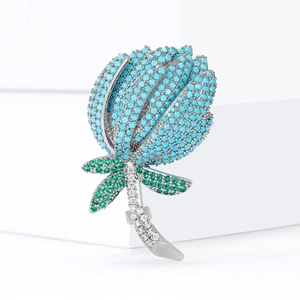 Broche tulipe avec strass bleus, feuilles vertes et monture argentée pour femmes