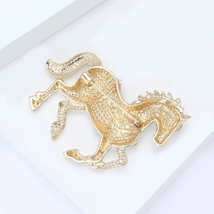 Golden horse brooch with secure pin back closure and textured metal finish